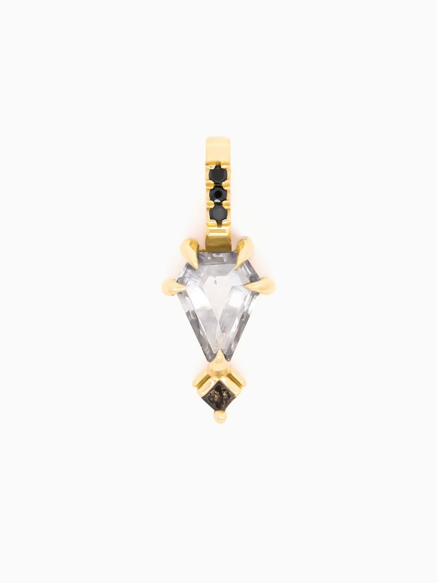 Gold pendant with a clear gemstone on a white background