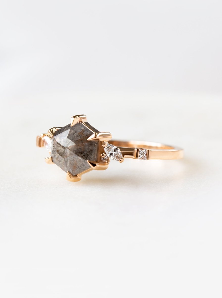 side view of hexagon salt pepper diamond ring with marquise and princess cut accents