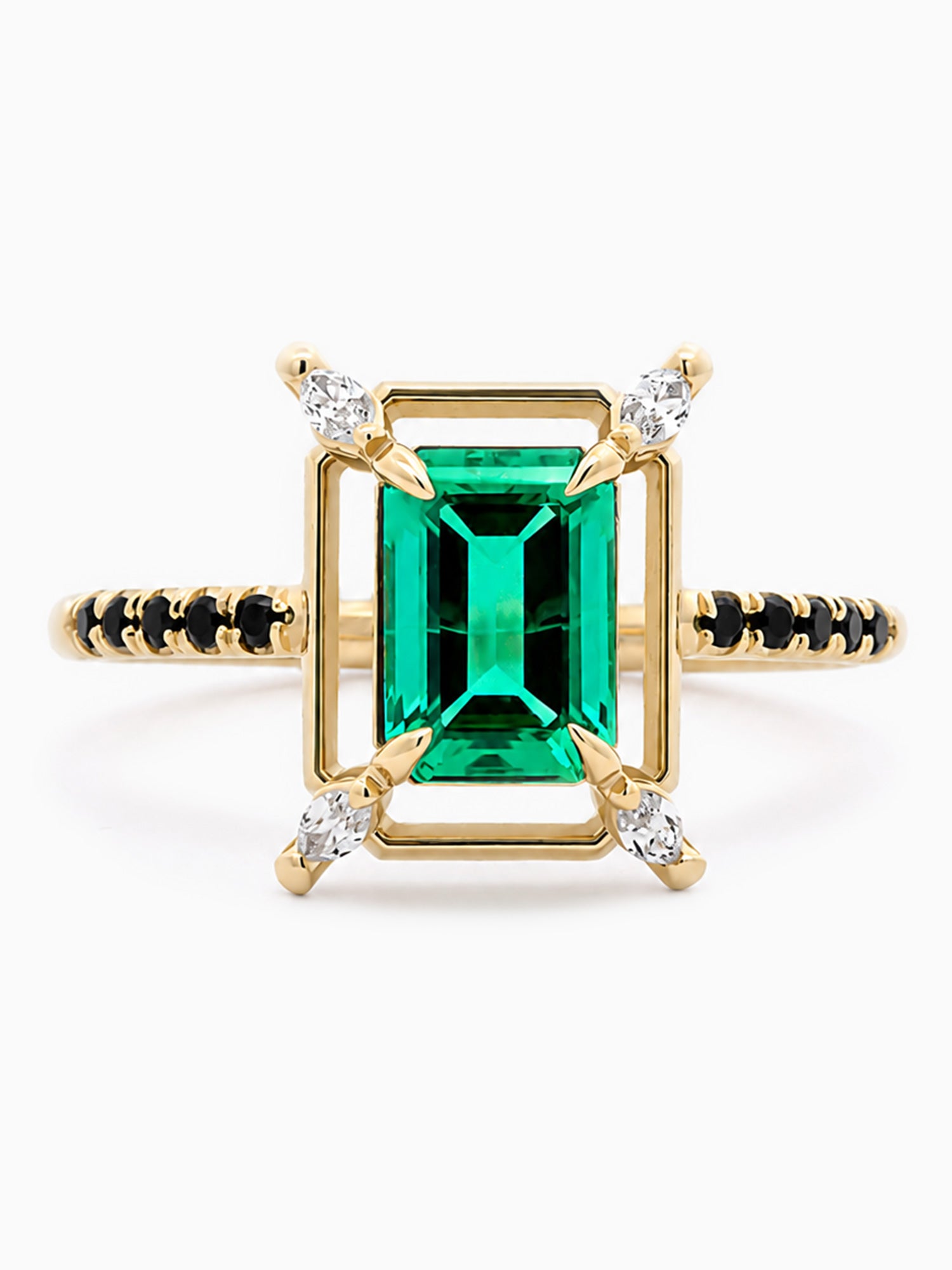 Gold ring with a green gemstone and diamond accents on a white background