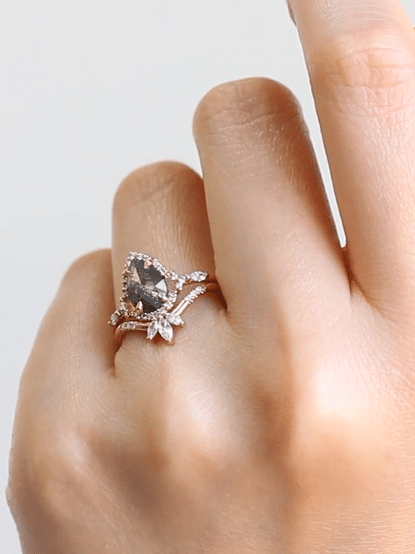 Pear-shaped salt and pepper diamond engagement ring in 14k rose gold inspired by the art deco style and minimalism.