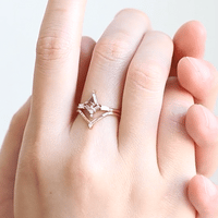 Kite salt and pepper diamond engagement ring in 14k rose gold with baguette and round diamonds inspired by the art deco style and minimalism.