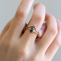 Unique art deco styled hexagon salt and pepper diamond engagement ring in 14k rose gold with smaller round diamonds.