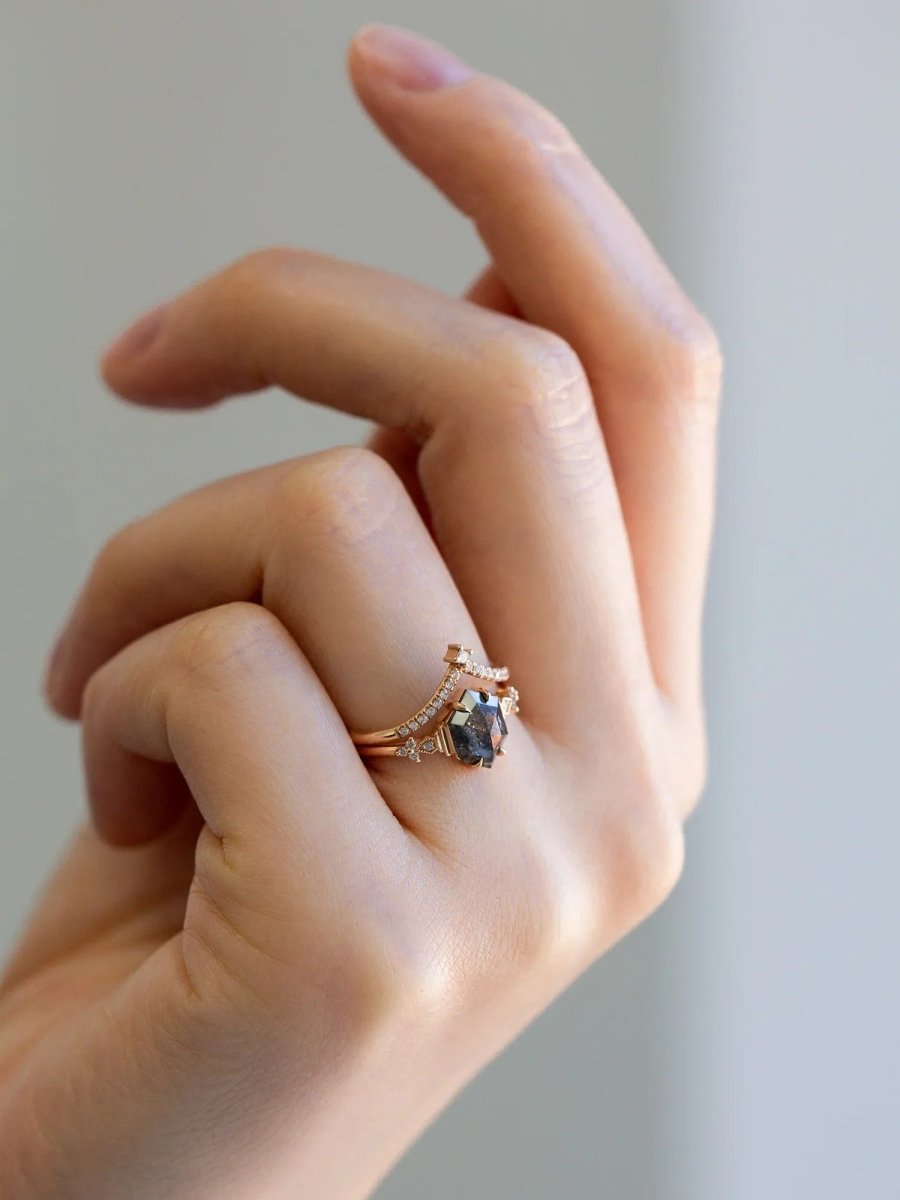 Minimalistic and art deco styled hexagon salt and pepper diamond engagement ring in 14k rose gold with round diamonds.