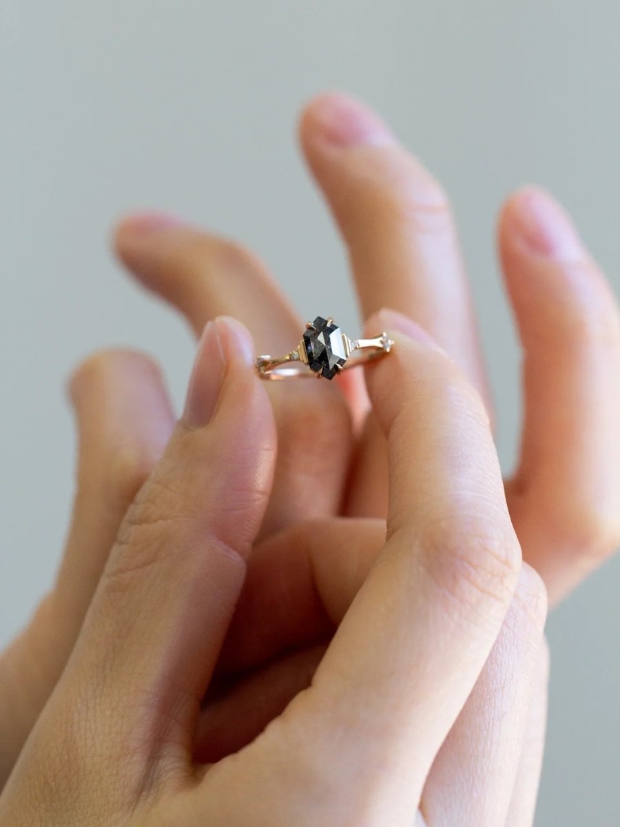 Unique art deco styled hexagon salt and pepper diamond engagement ring in 14k rose gold with smaller round diamonds.