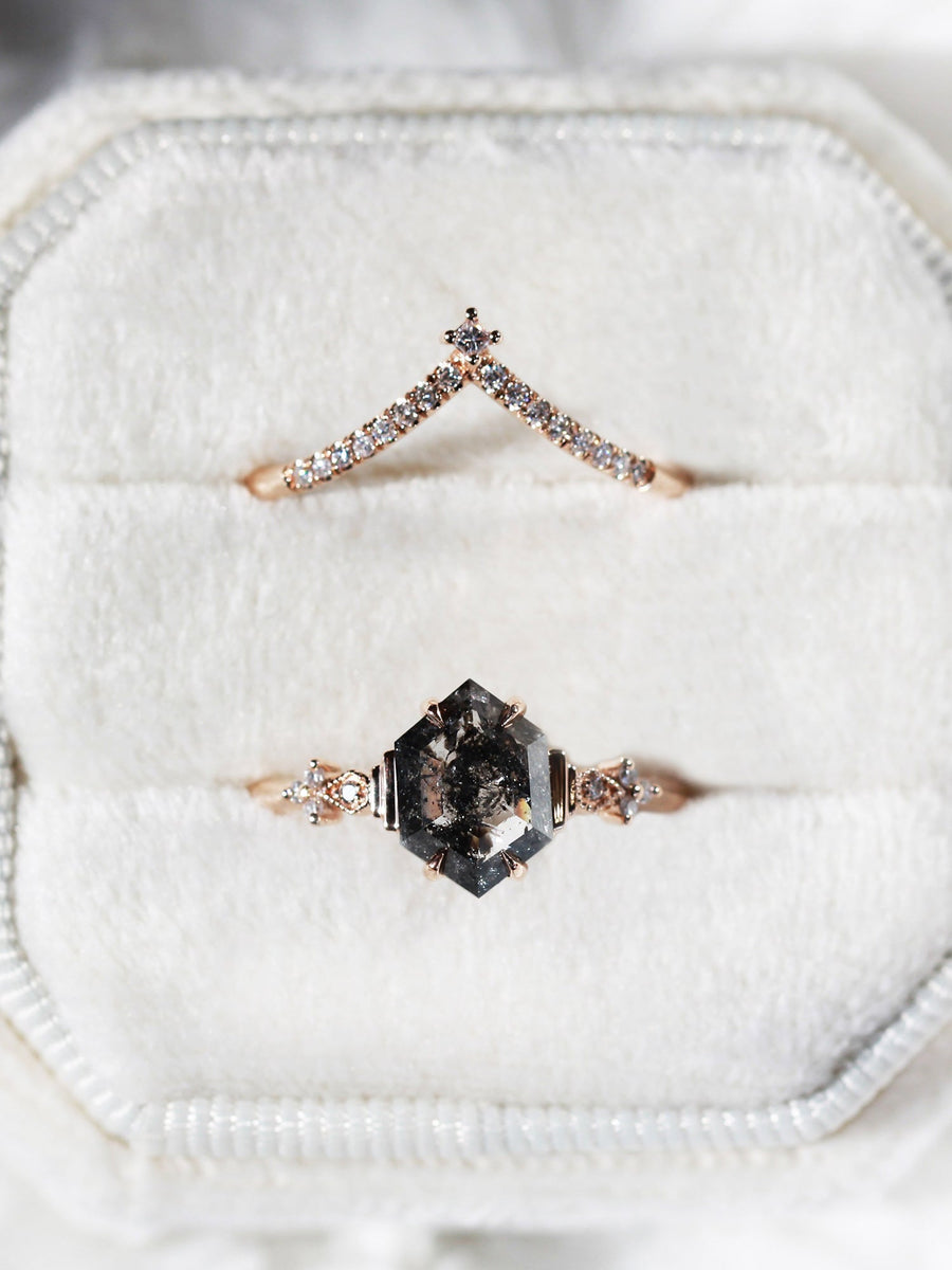 Minimalistic and art deco styled hexagon salt and pepper diamond engagement ring in 14k rose gold with round diamonds with matching band.