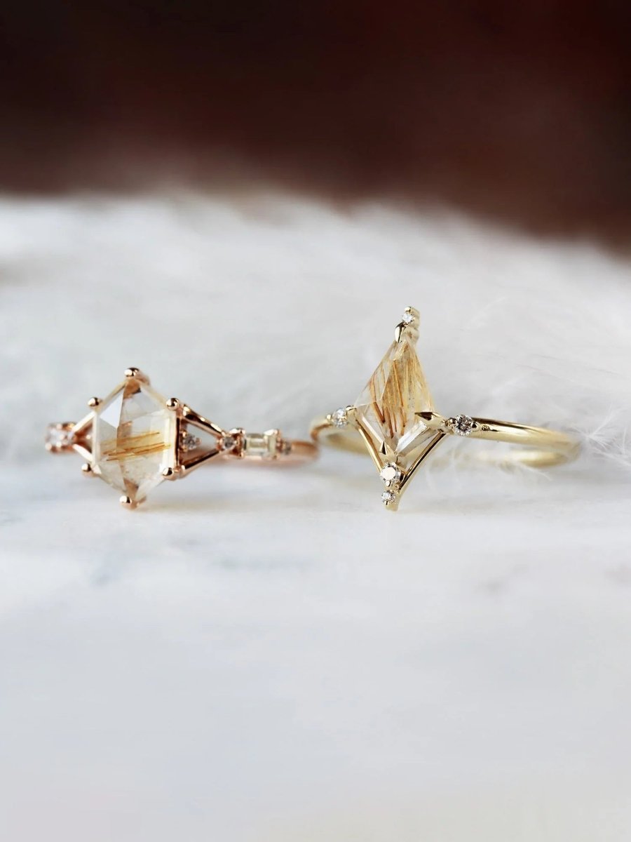 Hexagon rutilated quartz engagement ring in 14k rose gold with smaller baguette and round diamonds inspired by the art deco style and minimalism.