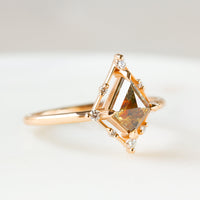 Minimal art deco styled kite shaped salt and pepper diamond engagement ring in 14k rose gold with smaller round diamonds.