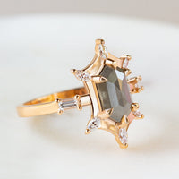 Unique art deco styled hexagon salt and pepper diamond engagement ring in 14k rose gold with six marquise and two baguette diamonds.