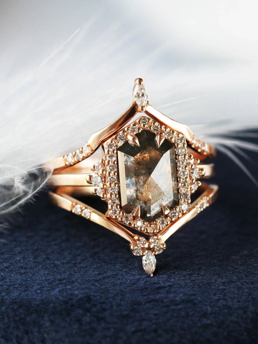 Unique art deco styled hexagon salt and pepper diamond engagement ring in 14k rose gold with round diamonds with matching bands.