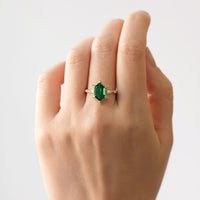 hiddenspace-jewelry-queen-of-ice-emerald-diamond-alternative-ring-14k-yellow-gold-hand-1