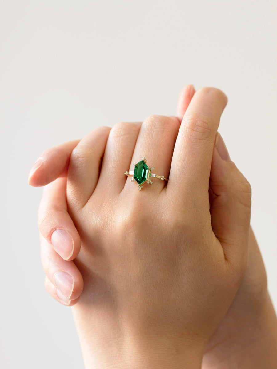 hiddenspace-jewelry-queen-of-ice-emerald-diamond-alternative-ring-14k-yellow-gold-hand-2