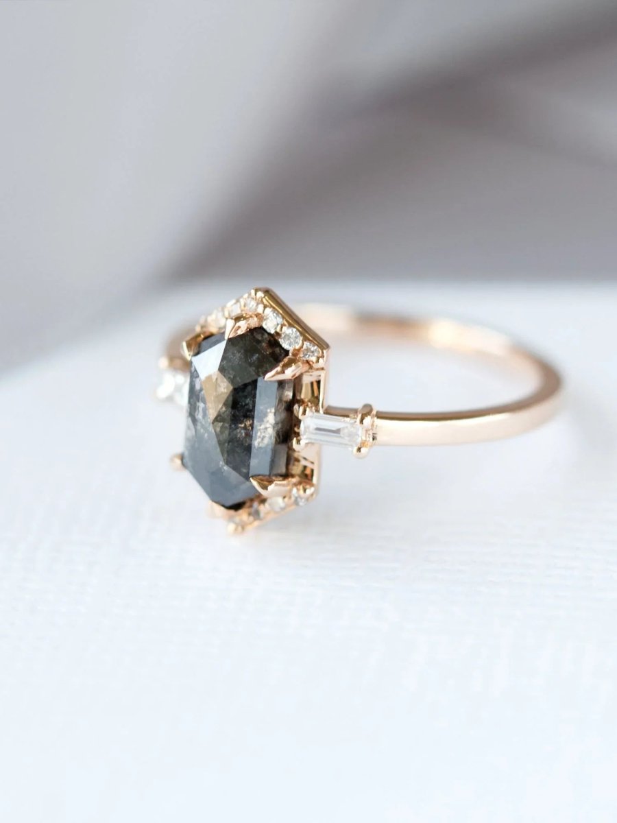 Unique art deco styled hexagon salt and pepper diamond engagement ring in 14k rose gold with baguette and round diamonds.