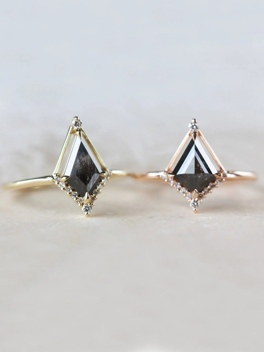 Kite shape salt and pepper diamond engagement ring with smaller round diamonds in 14k gold inspired by the art deco style and minimalism.