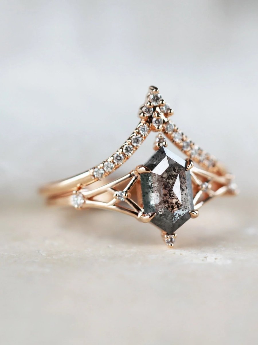 Hexagon salt and pepper diamond engagement ring in 14k rose gold with smaller and round diamonds inspired by the art deco style and minimalism.
