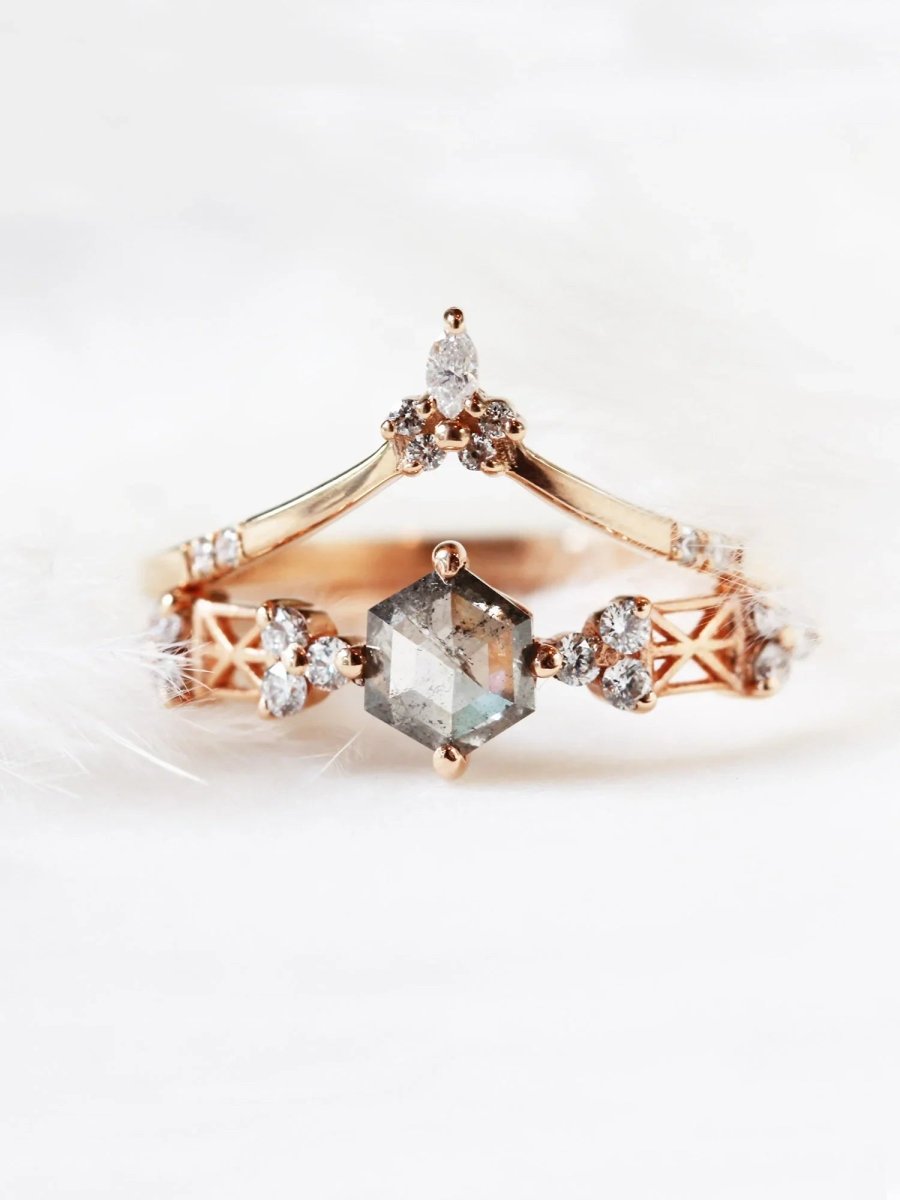 Modern Art Deco engagement ring with a salt and pepper hexagon diamond center, round trefoil clusters, architectural latticework, stacked under a chevron band