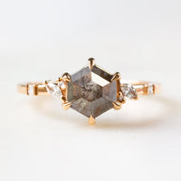 Unique art deco styled hexagon shaped salt and pepper diamond engagement ring in 14k rose gold with smaller marquise, round, and princess cut diamonds.