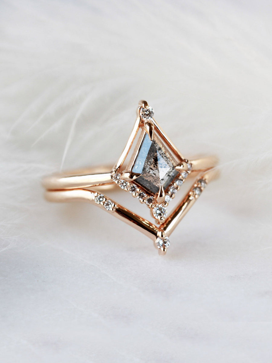 Kite shape salt and pepper diamond engagement ring with smaller round diamonds in 14k gold inspired by the art deco style and minimalism.
