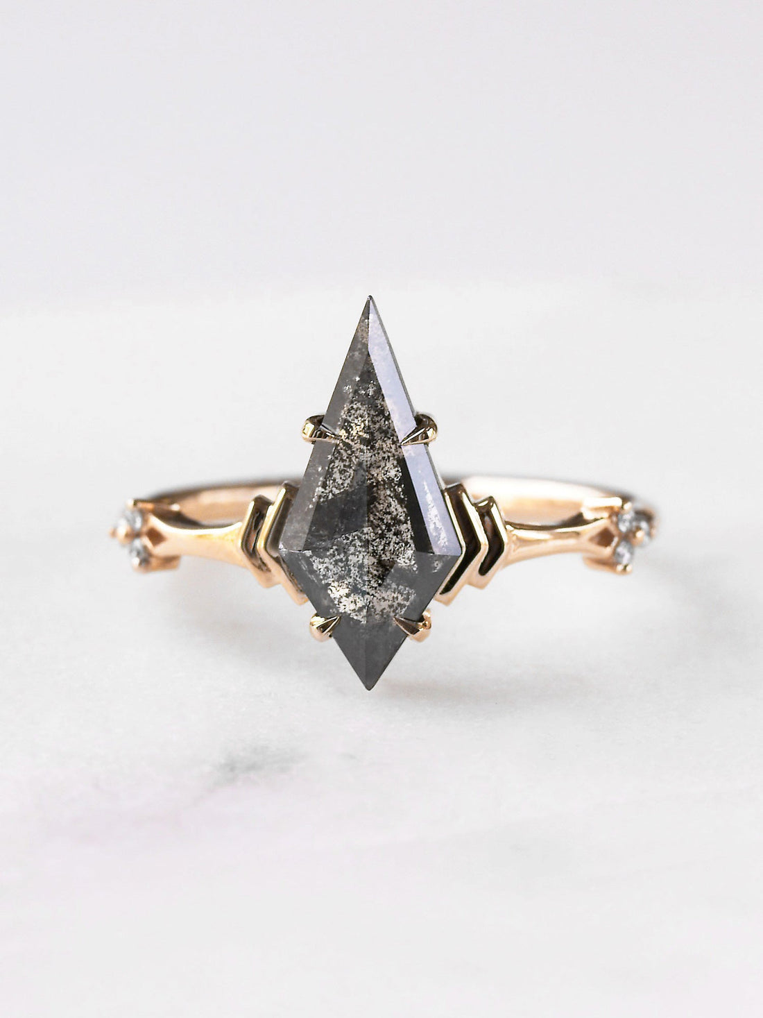 Kite salt and pepper diamond engagement ring in 14k rose gold inspired by ancient greek architecture.