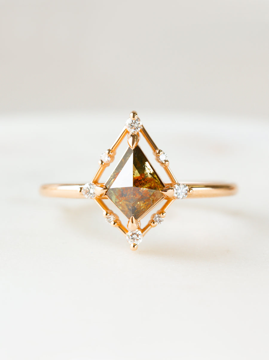 Minimal art deco styled kite shaped salt and pepper diamond engagement ring in 14k rose gold with smaller round diamonds.